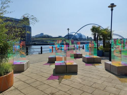 Duo blocks used as seating in a colourful quayside art installation