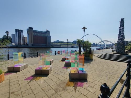 Duo blocks forming plinths in a colourful quayside art installation