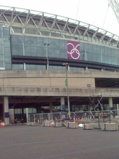 Ballast blocks holding temporary fencing on paving outside Wembley Stadium