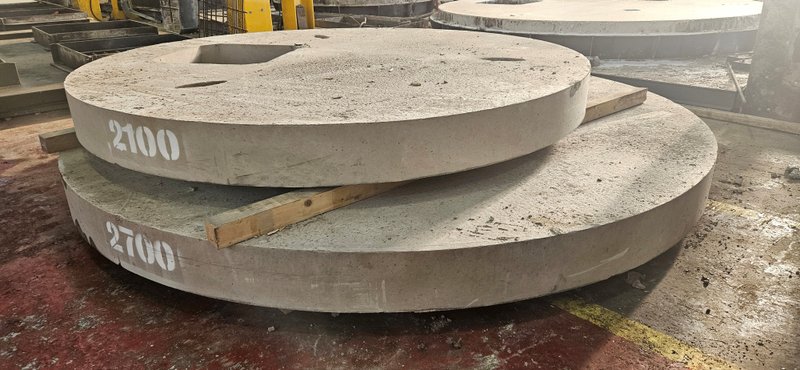 Circular 2700 cover slab stacked under a 2100 slab in the works