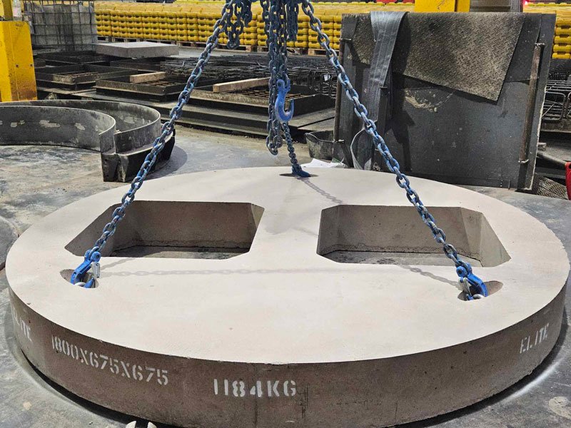 Chain-slung circular cover slab marked 1800x675x675 and 1184kg