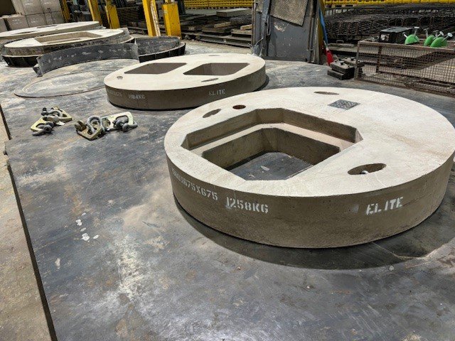 Bespoke circular cover slabs with shaped openings on the factory floor
