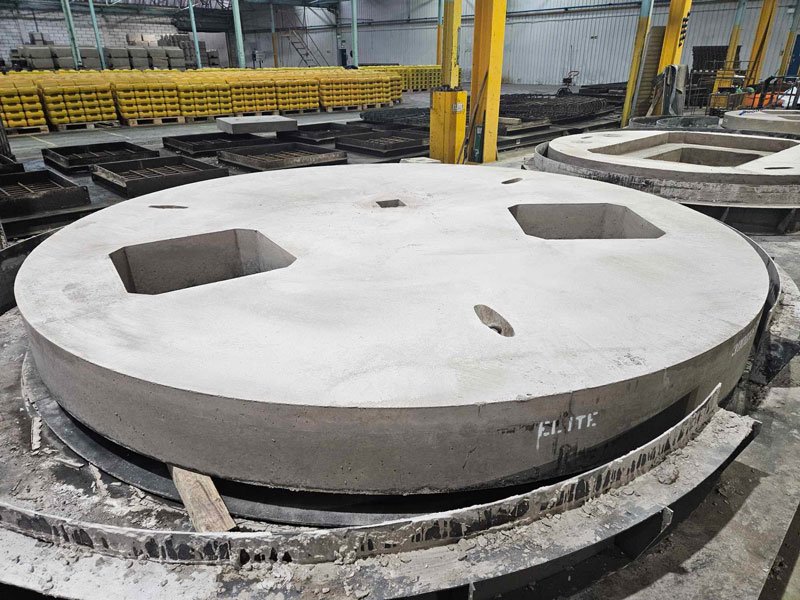 Large circular cover slab with two square openings stacked in the works