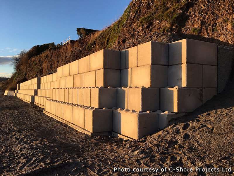 Legato blocks stacked into a wall retaining an eroding coastal embankment