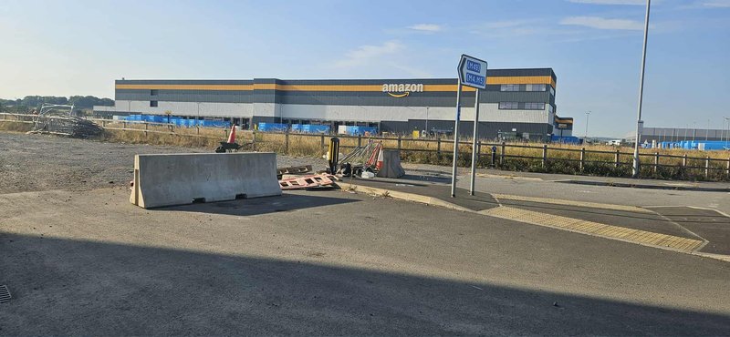 Jersey barrier placed across an access road at a distribution centre