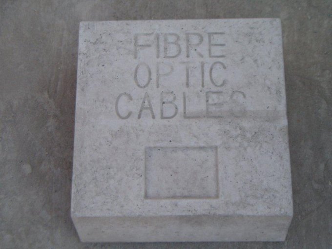 Concrete marker block cast with the words fibre optic cables