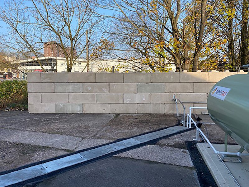 Precast block blast wall screening a bulk gas storage tank and pipework