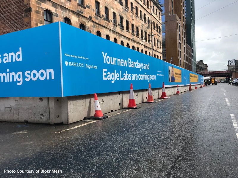 TVCB barriers clad with printed hoarding panels lining a city street closure