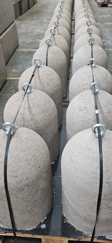 Palletised concrete bollards strapped together and linked with chain