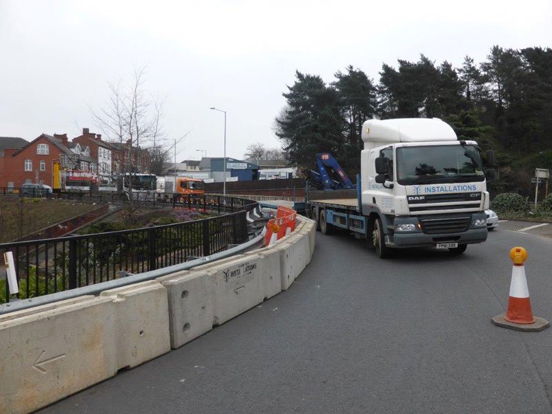TVCB barriers installed along a roadside with a delivery lorry alongside