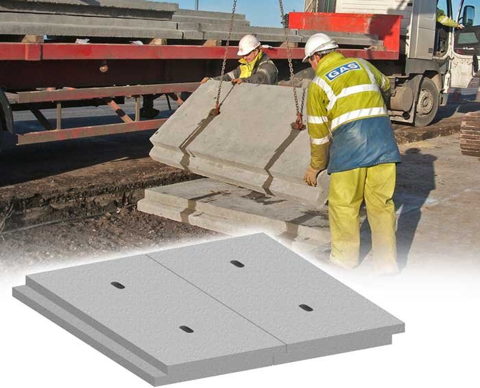 Worker unloading a precast protection slab from a lorry beside a product render