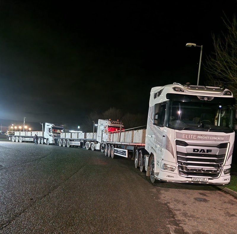 Delivery lorries lined up at night ready to take blocks to site