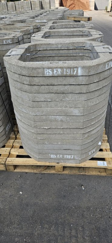 Stack of 675 x 675 seating rings on a timber pallet in the yard