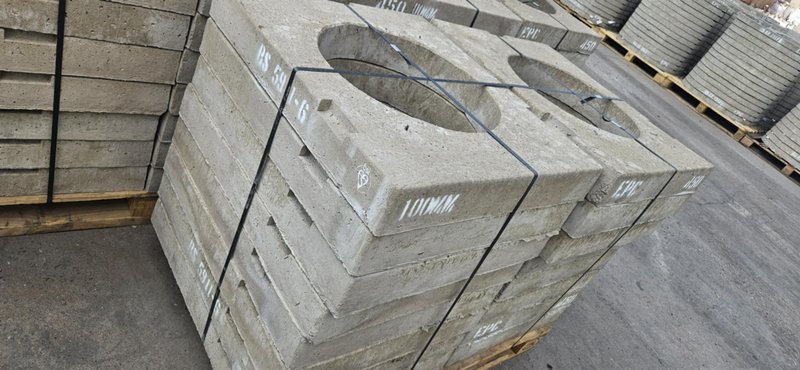 Square gully covers stacked on pallets in the storage yard