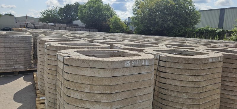 Rows of stacked concrete seating rings filling a manufacturing yard
