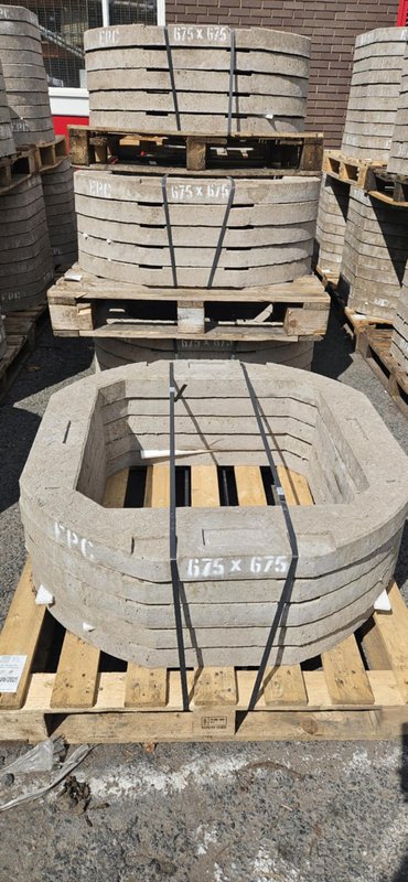 Banded 675 x 675 seating rings stacked on pallets in the storage yard