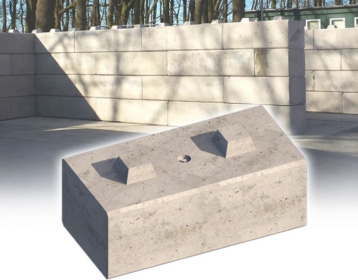 Single Duo interlocking block shown in front of stacked block walling