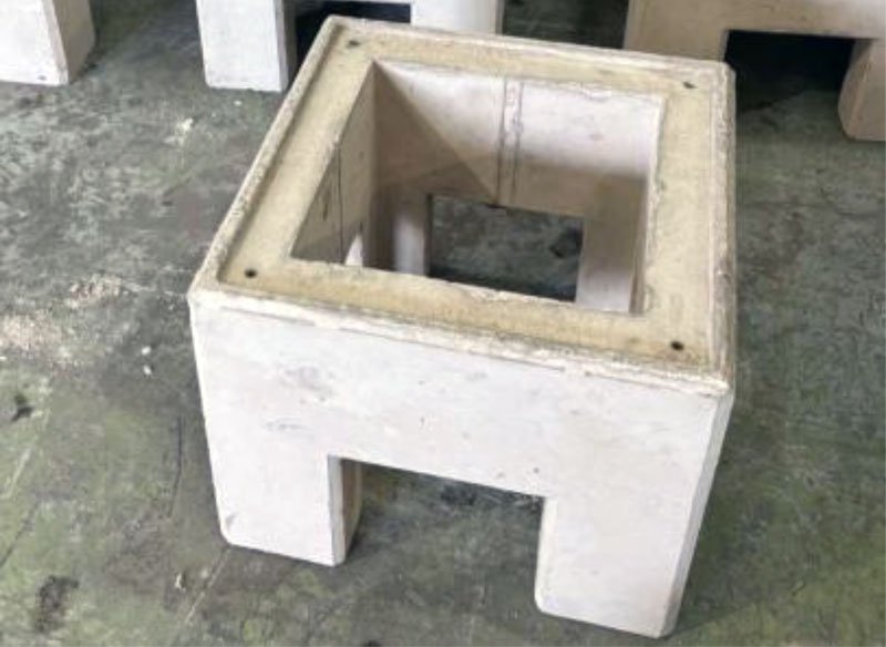 Open precast concrete charging base unit with a cable entry slot