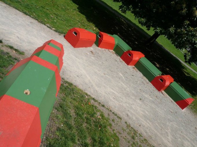 Red and green painted Duo blocks forming a winding play park feature