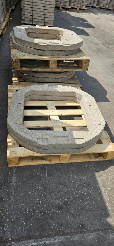 Two 750 x 600 seating rings resting on timber pallets in the yard