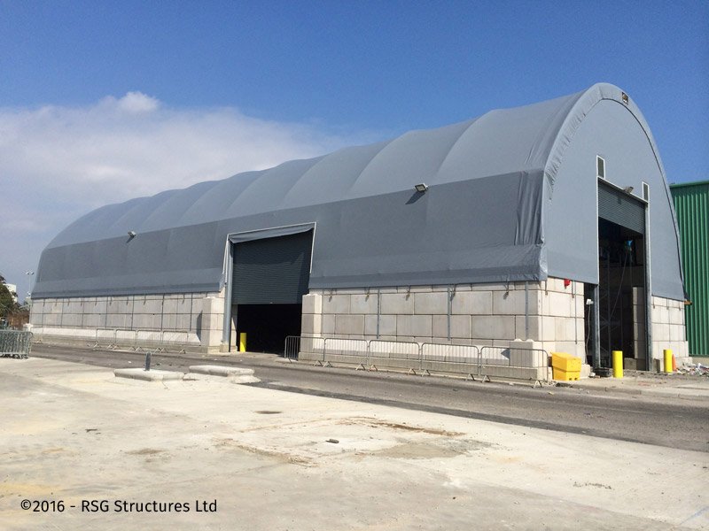 Large fabric-covered storage unit on Legato block walls with wide openings