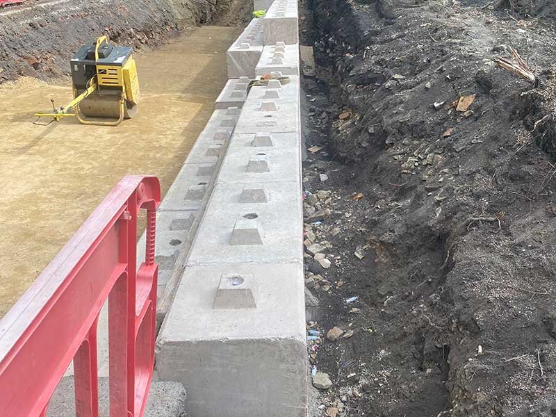 Double stacked Duo block retaining wall beside an excavated trench