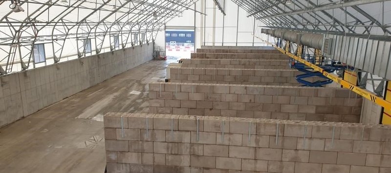 Legato block storage bays lining the inside of a large processing building