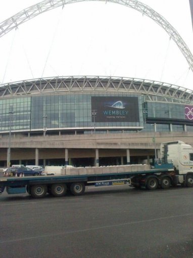 Lorry delivering kentledge ballast blocks outside Wembley Stadium