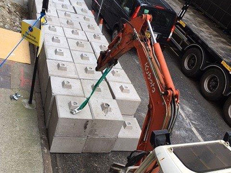 Kentledge blocks stacked at the kerb during offloading from a lorry