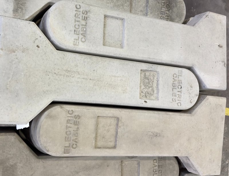 Concrete cable marker posts cast with Electric Cables lettering stacked flat