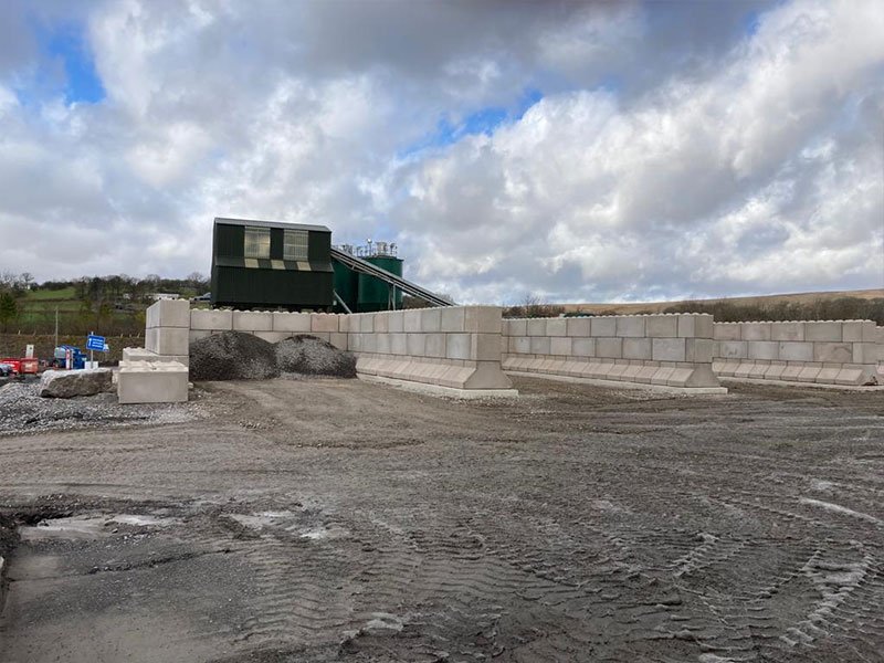 Legato interlocking block bay walls holding material stockpiles at a quarry