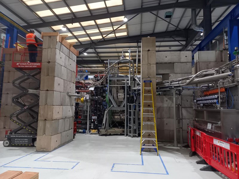 Interlocking blocks forming a shielded enclosure inside an industrial building