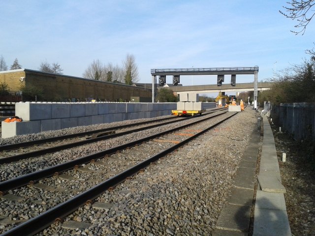Legato interlocking block safety walling running alongside railway tracks