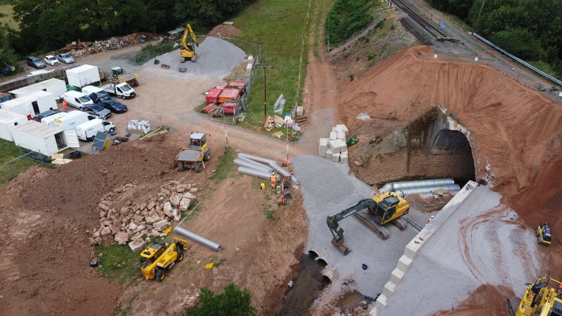 Aerial view of a construction site with interlocking block retaining walls and site plant