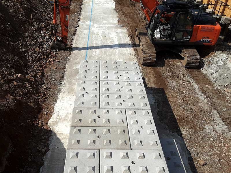Legato blocks laid flat to form a ramp base between two excavators