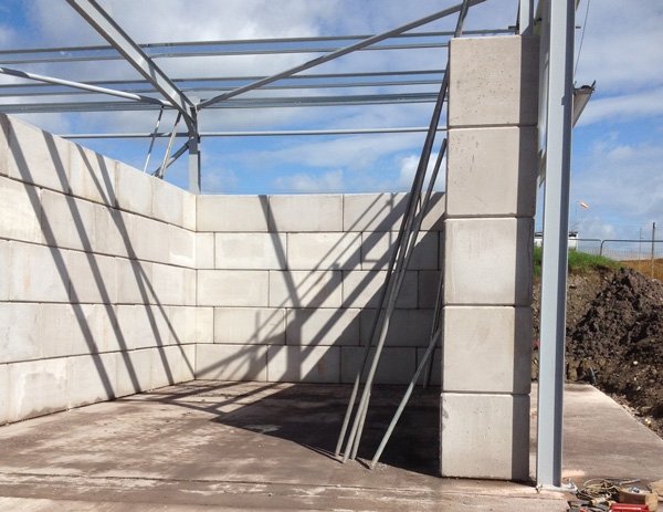 Legato interlocking block storage bays beneath a newly erected steel framed building