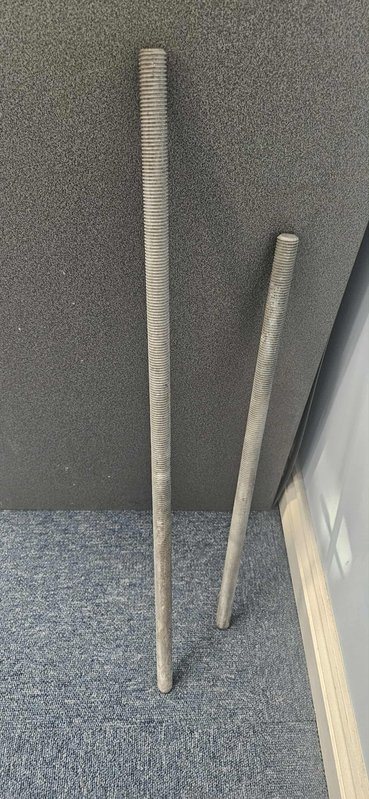Two threaded steel connection rods used to install Retainer-Rock units