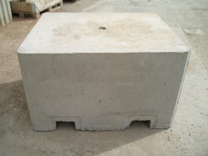 Concrete security block with forklift pockets cast into its base