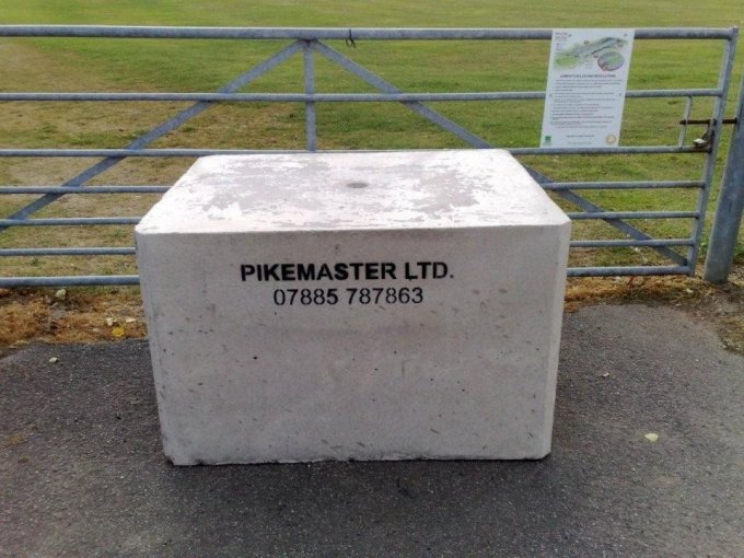 Security block marked Pikemaster Ltd set in front of a farm field gate
