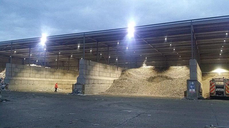 Floodlit shed with Legato block bay walls holding large aggregate stockpiles