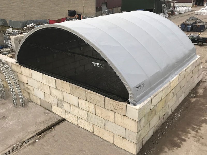 Curved fabric roof canopy mounted on Legato interlocking block bay walls