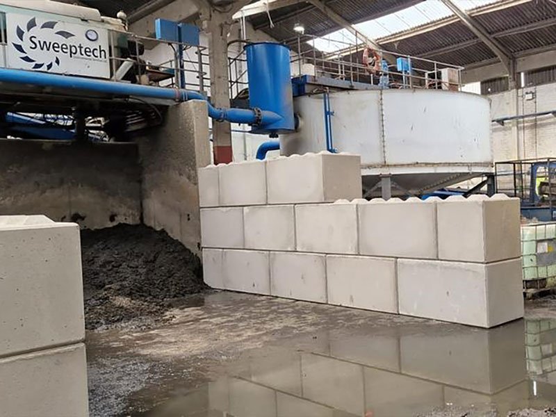 Legato block segregation wall beside pipework in a wash plant building