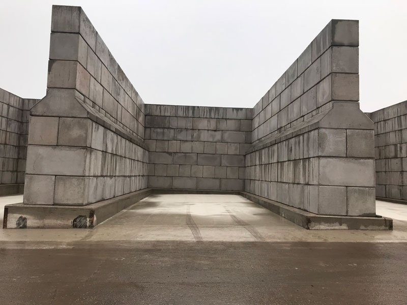Three-sided Legato block storage bay standing on a clean concrete slab