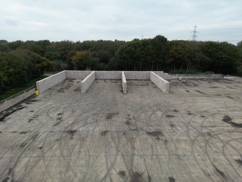 Empty Legato block storage bays on a concrete pad in open countryside