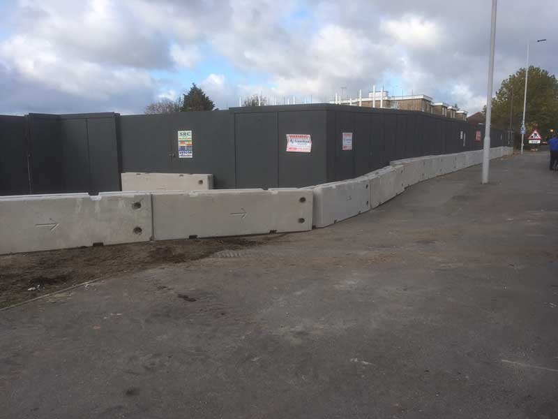 TVCB barriers lined along the edge of a hoarded housing development site
