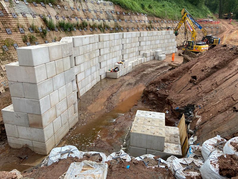 Interlocking block walls forming a fish pass channel in a river bed