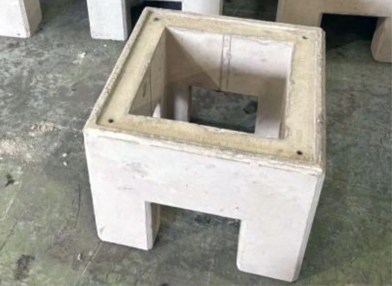 Hollow precast concrete EV charging base unit with an open cable void