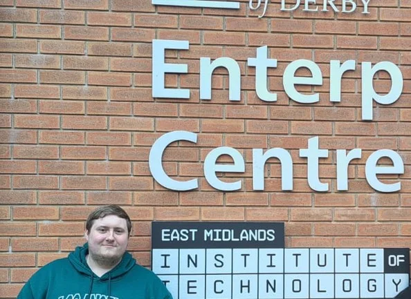 Man standing outside the Enterprise Centre at East Midlands Institute of Technology