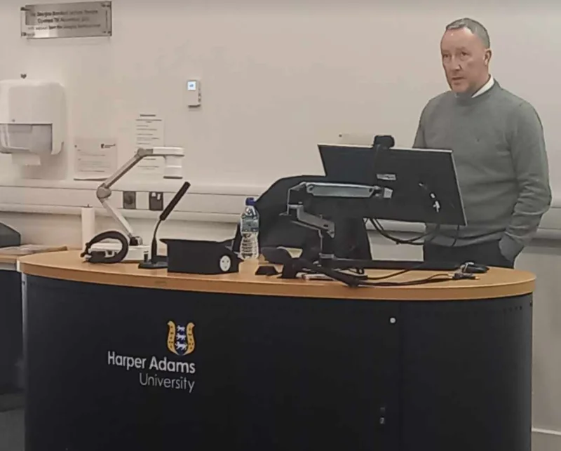 Man presenting from a lectern at Harper Adams University